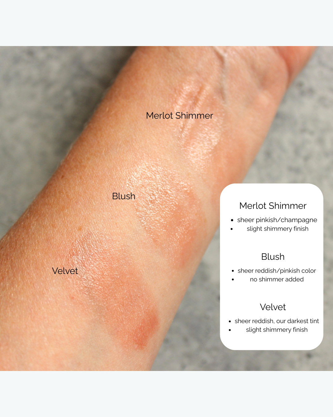 Swatches of makeup on a person's arm with labels for Merlot Shimmer, Blush, and Velvet finishes.