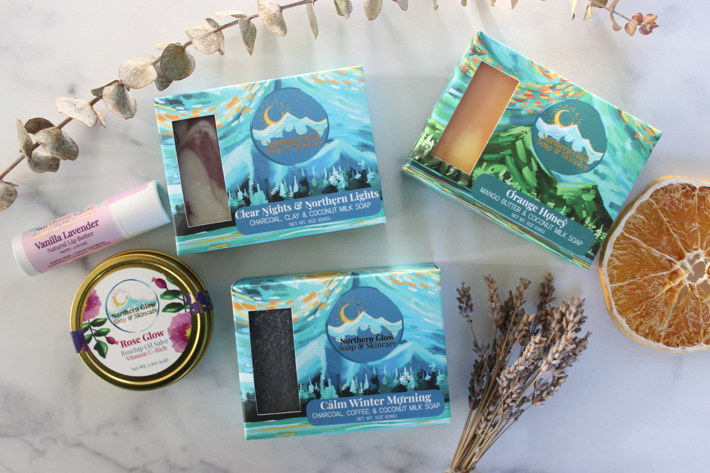 Collection of soap and skincare on a marble surface.