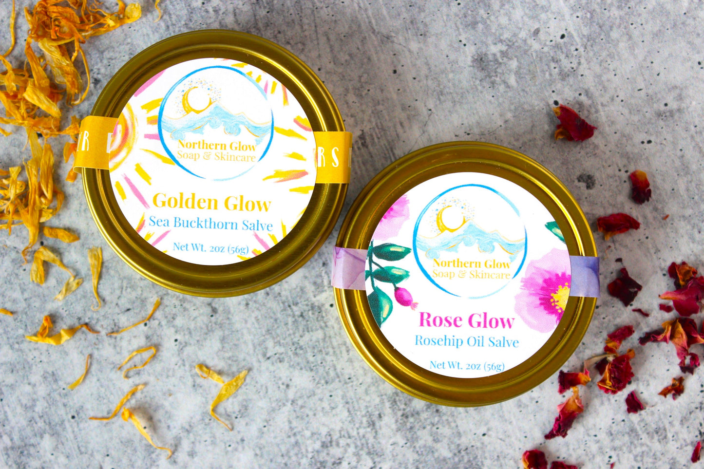 Natural salves by Northern Glow Soap and Skincare. Golden Glow and Rose Glow are in golden tins.