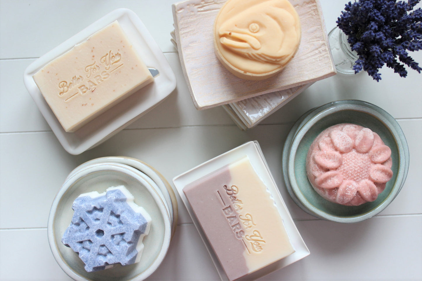 Better For You Bars natural soaps sitting on ceramic handmade soap dishes.