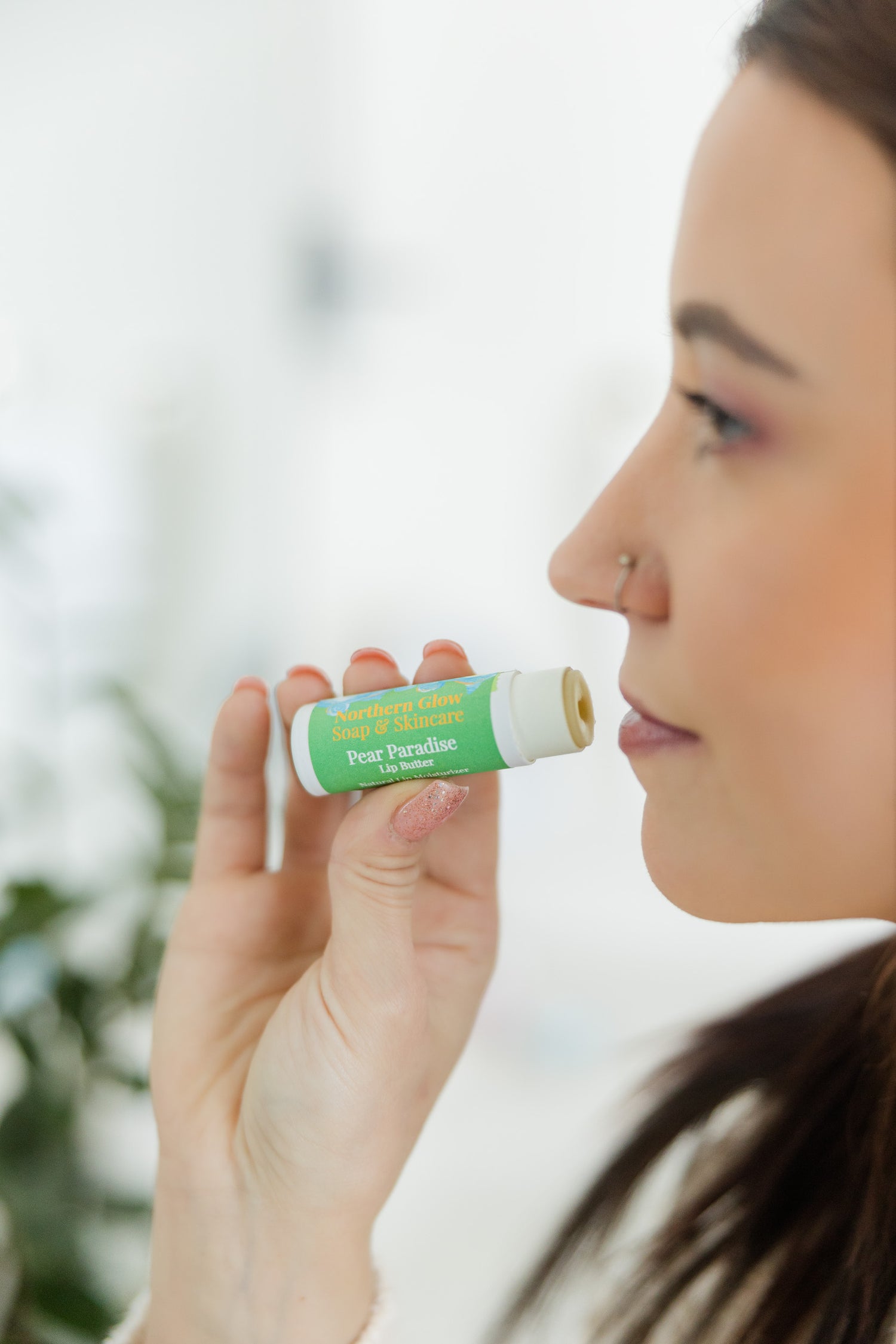 Alaskan made lip balm in a woman's hand.
