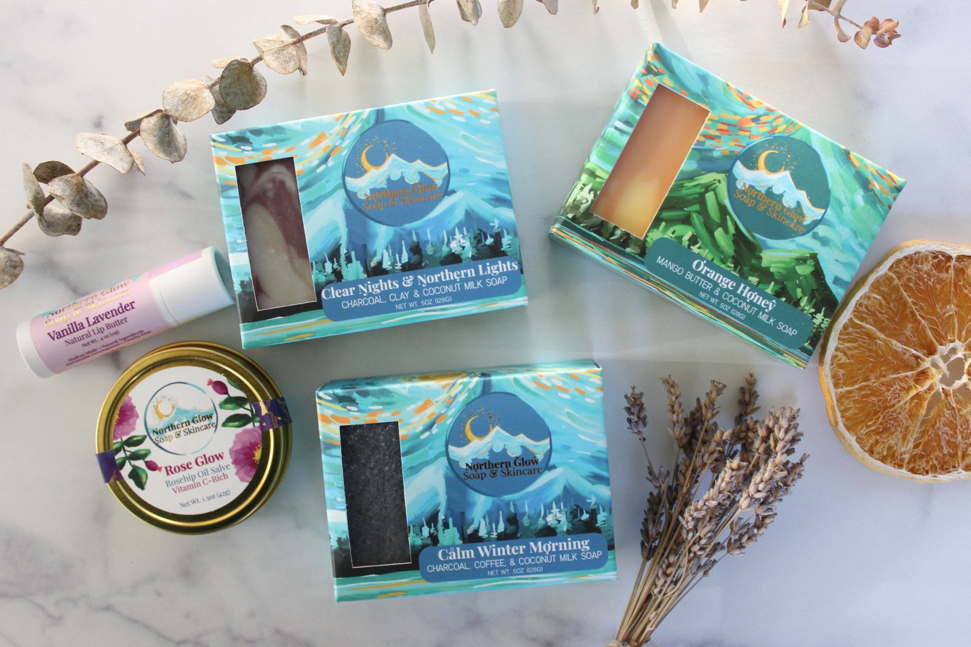 Collection of soap and skincare on a marble surface.
