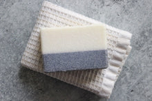 Load image into Gallery viewer, Alaskan Saltwater bar soap on a white wash cloth.
