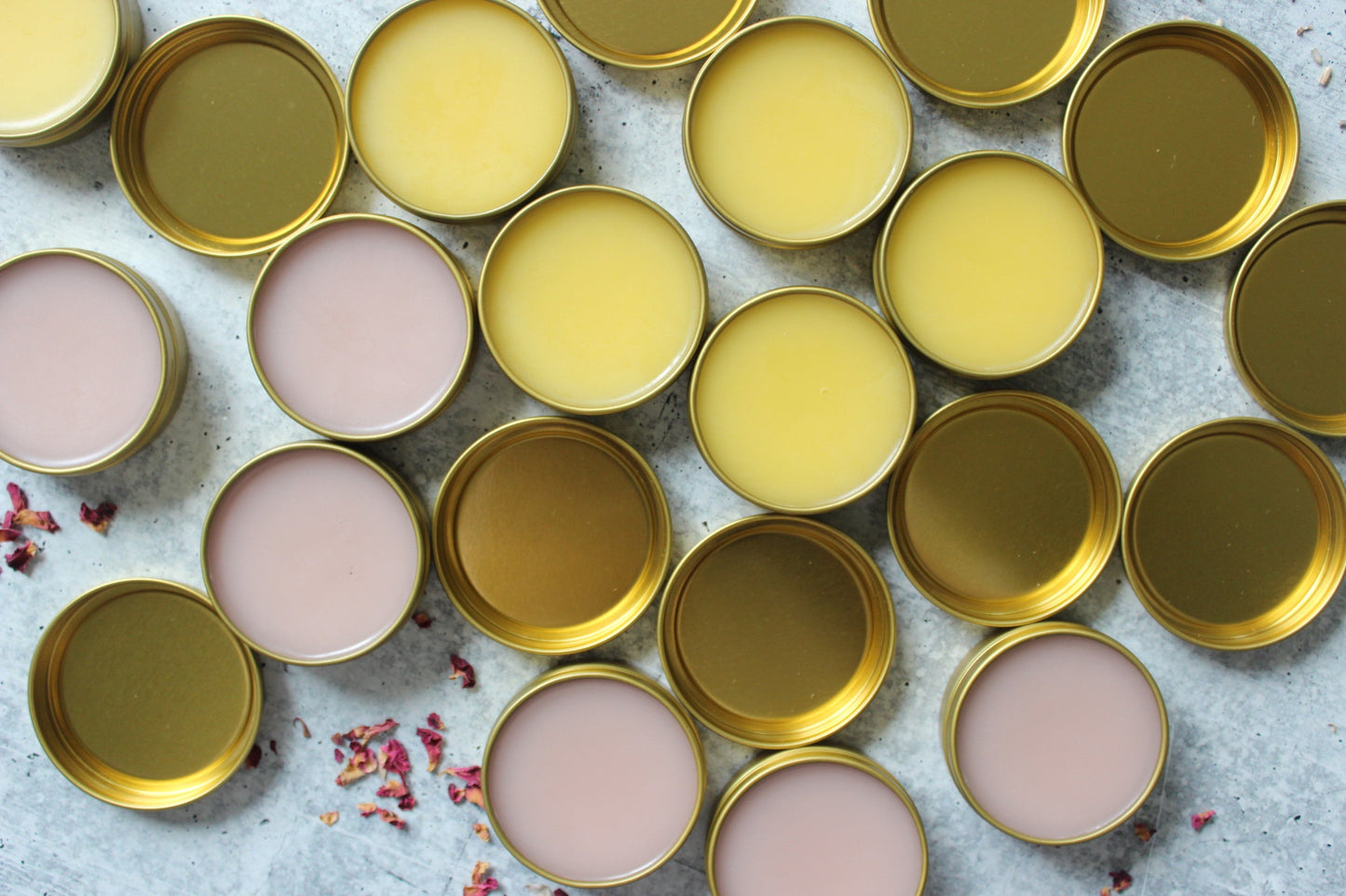 Apricot Oil and Beeswax Salves in golden tins.
