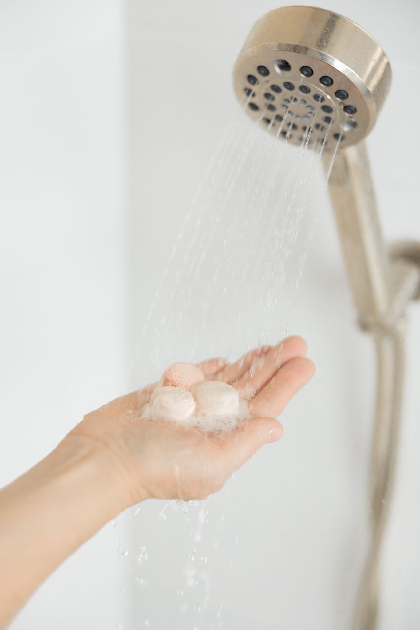 Aromatherapy shower steamers fizzing in a shower.