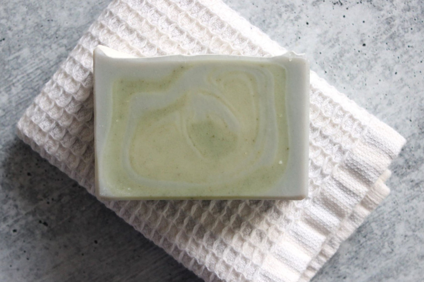 Bergamot soap on a white washcloth.