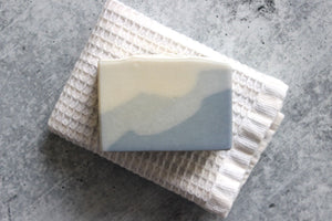 Clay soap with kelp.  Ocean inspired soap on a white washcloth.
