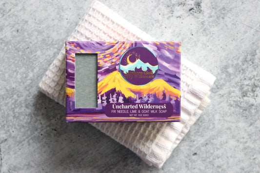 Fir needle and goat milk soap in a purple box.