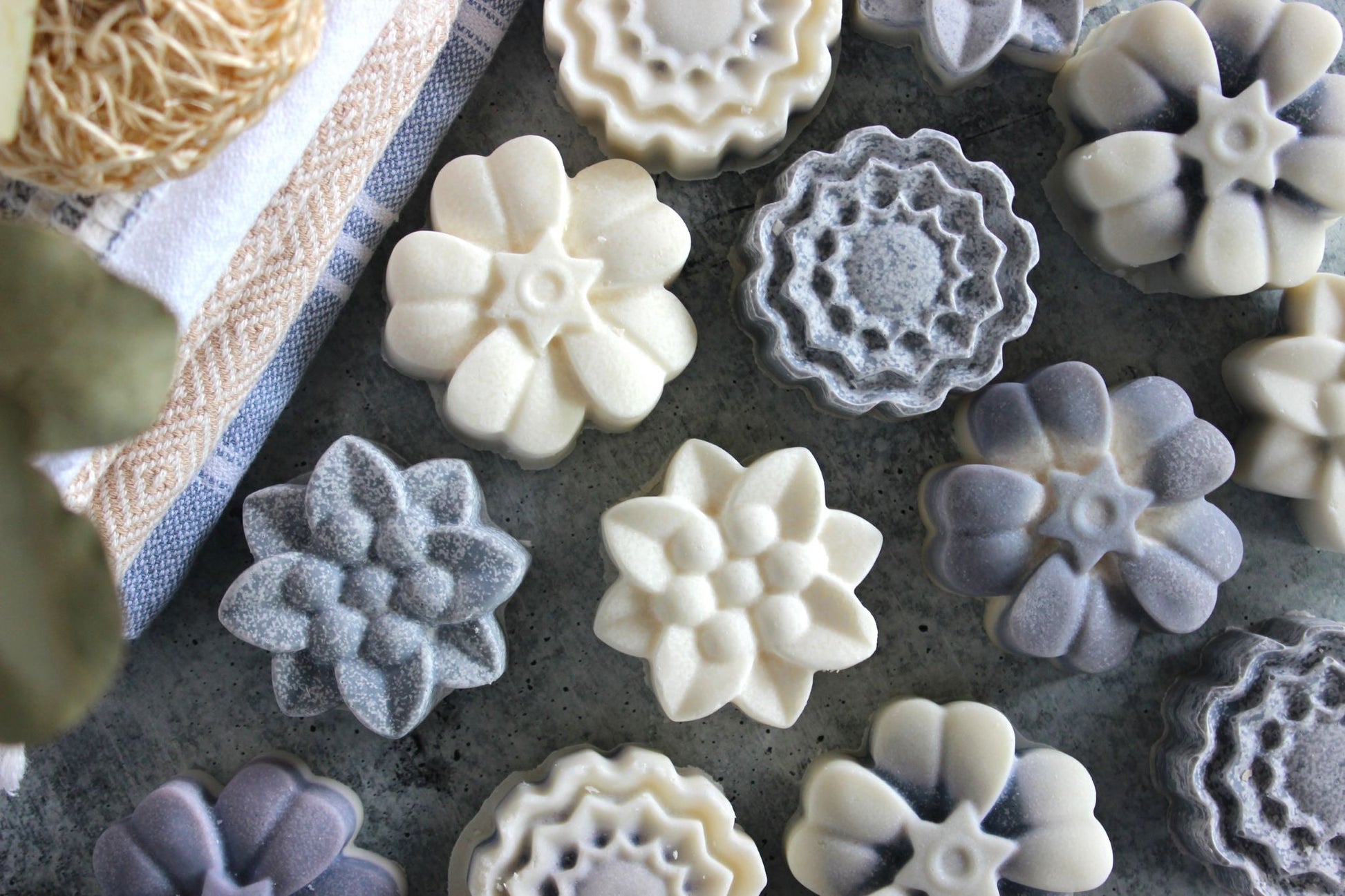 Floral shaped Alaskan Saltwater soaps in blues and whites.