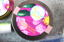 Load image into Gallery viewer, Jojoba Oil and shea butter lotion bar in a silver tin with a pink label.
