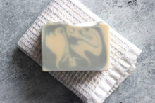 Load image into Gallery viewer, Lavender, Lemon and Sage soap on a white washcloth.
