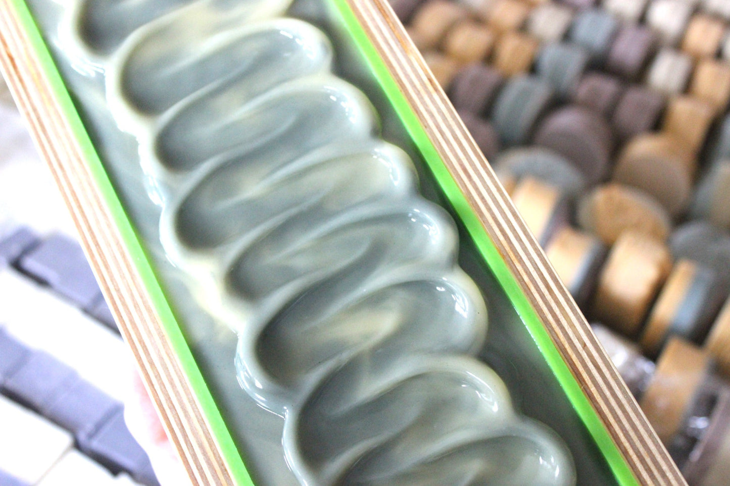 Freshly poured Lavender and Lemon Goat Milk Soap in a wooden mold.