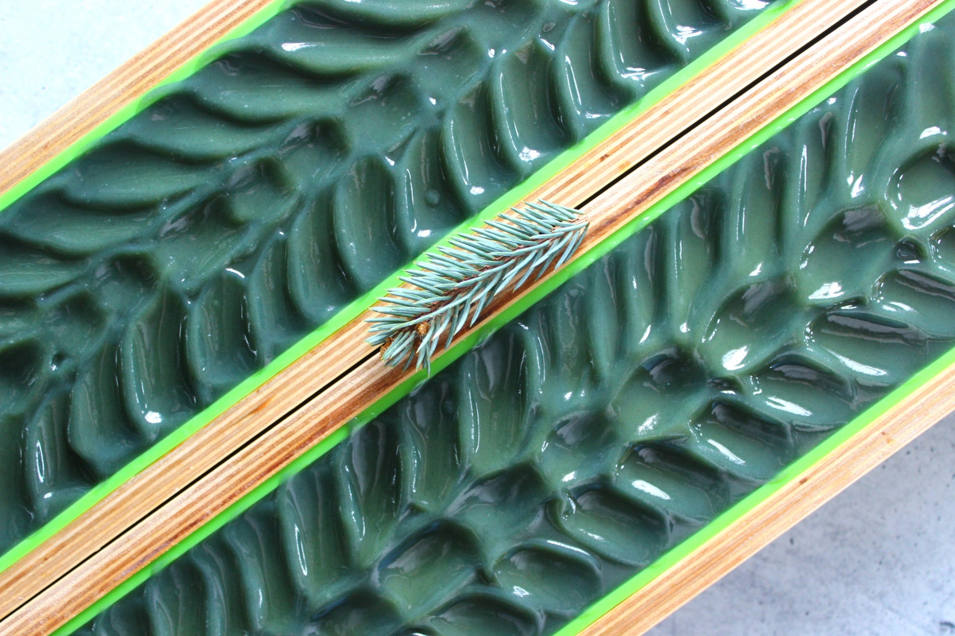 Freshly poured Lime, Fir Needle and Goat Milk Soap in wooden molds.