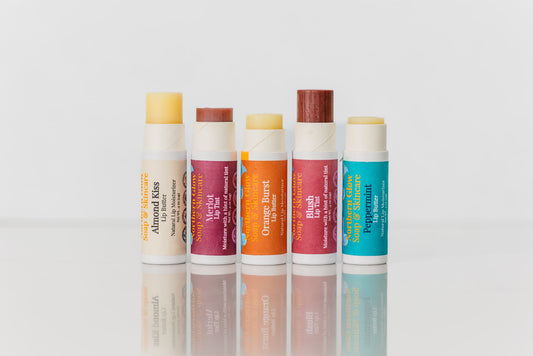 Lip balms in a row with product pushed up.