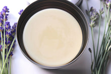 Load image into Gallery viewer, Mango Butter Lotion Bar in tin.  Dried lavender rest around tin.
