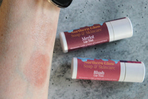 Natural Lip and Cheek Tints in Blush and Merlot on skin.