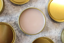 Load image into Gallery viewer, Natural salves with beeswax and rosehip oil in a golden tin.
