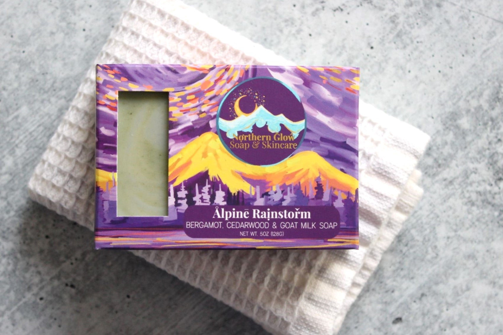Northern Glow Soap Cedarwood and Citrus Bar Soap with Goat Milk on a washcloth