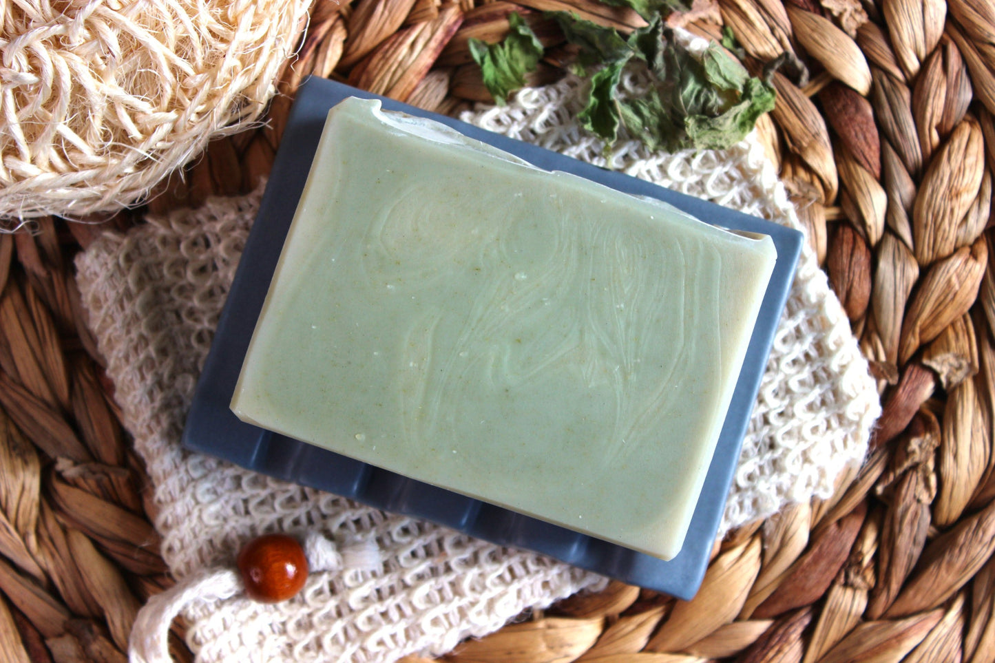 Northern Glow Soap Cedarwood and Citrus Bar Soap with Goat Milk on a soap dish