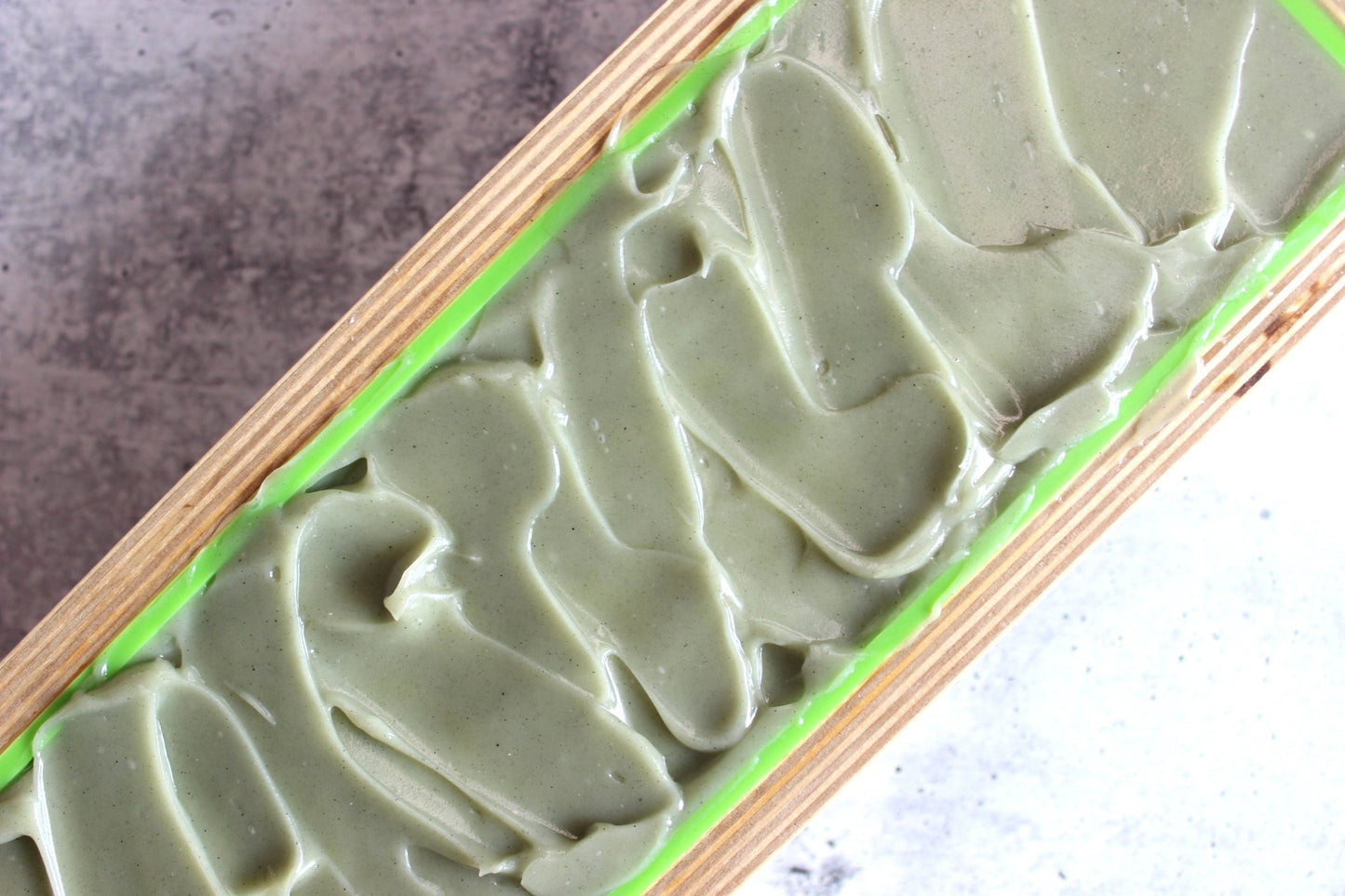 Northern Glow Soap Cedarwood and Citrus Bar Soap with Goat Milk in a wooden mold