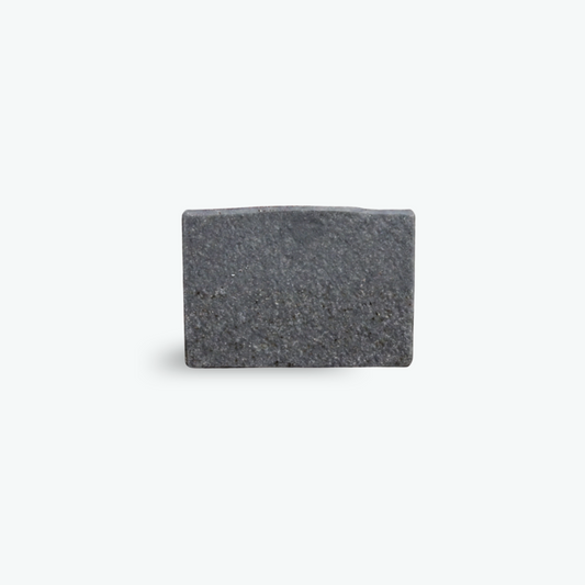 Charcoal and exfoliating coffee soap with a white background.