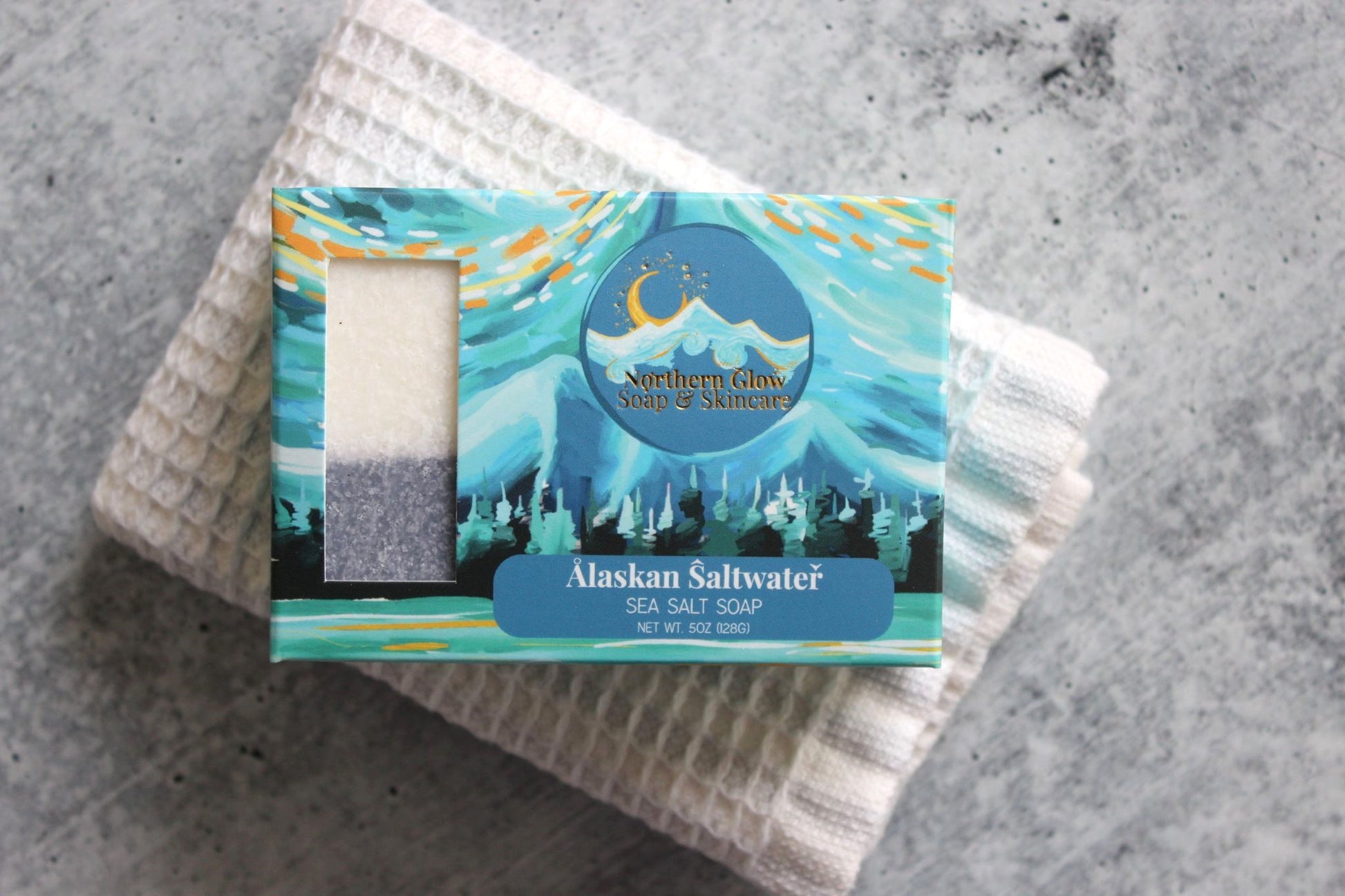 Northern Glow Soap Cleansing Sea Salt & Alaska Glacial Water Bar Soap on a white washcloth