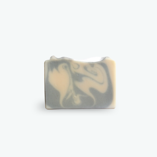 Mild olive oil and lavender soap, with swirls of gray / blue, on a white background.