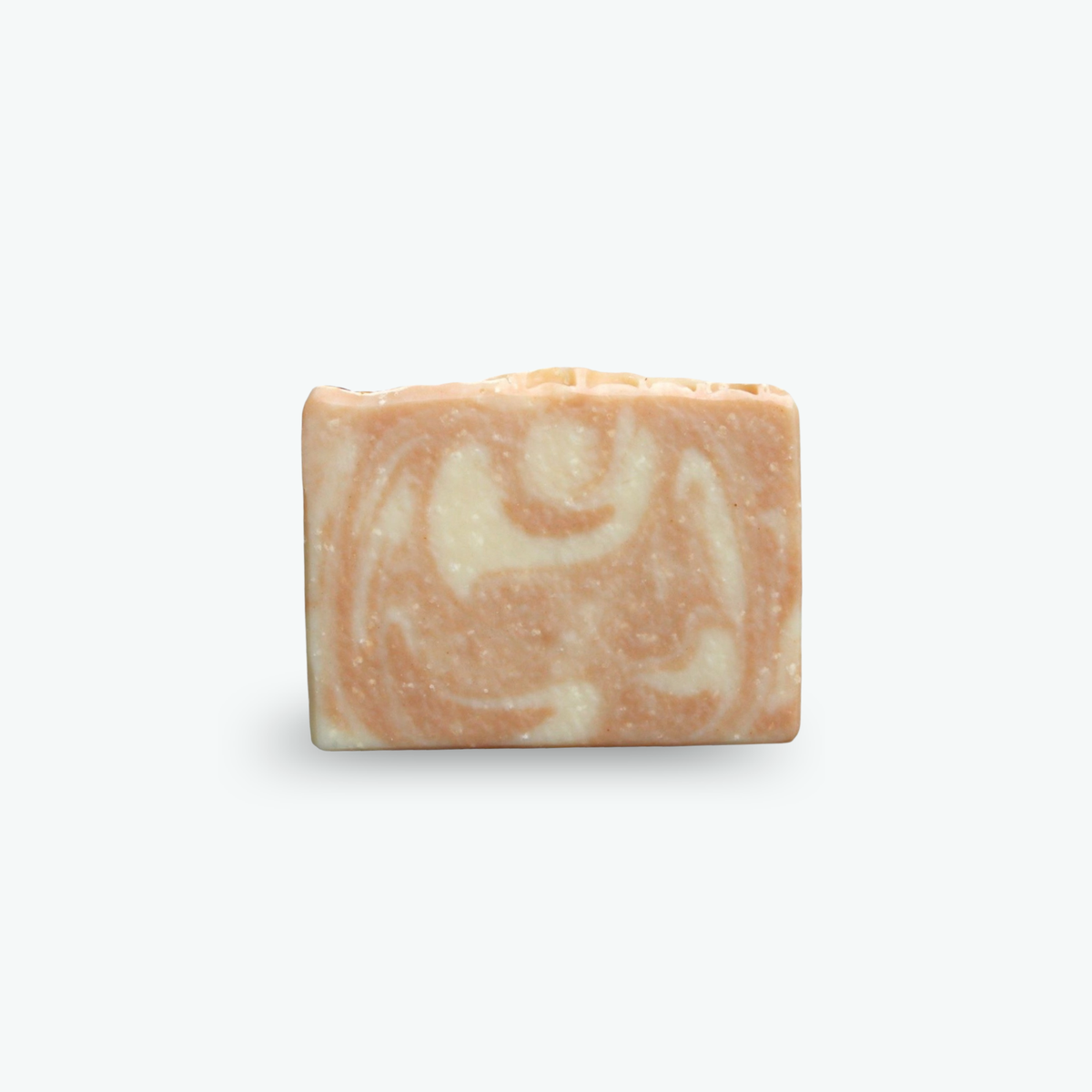 A rectangular bar of marbled soap in orange and cream swirls, centered on a clean white background.