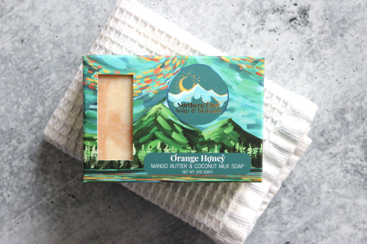 Orange and Alaska Honey Soap in a green box.