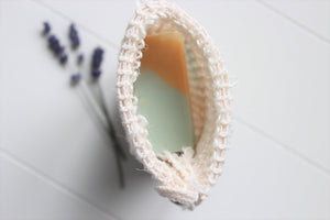 Cambric soap saver with a soap inside.  Dried lavender in background.