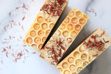 Load image into Gallery viewer, Orange Honey Soap with a honey comb effect and orange flowers.
