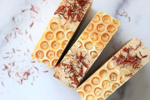 Orange Honey Soap with a honey comb effect and orange flowers.